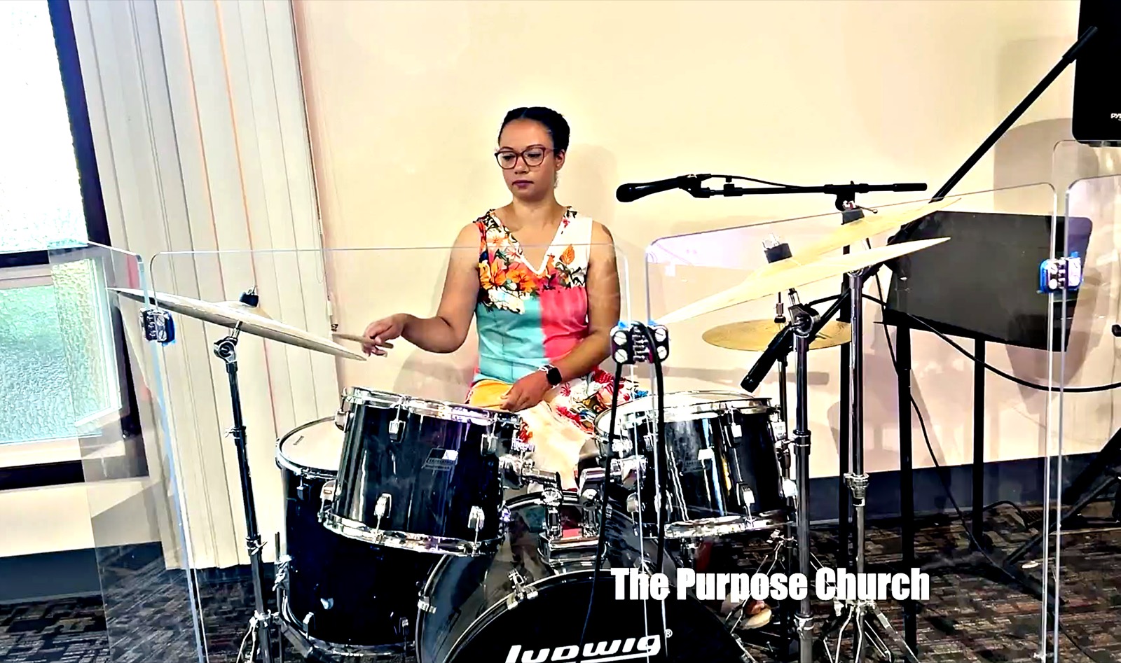 Drummer leading worship with the family band at The Purpose Church